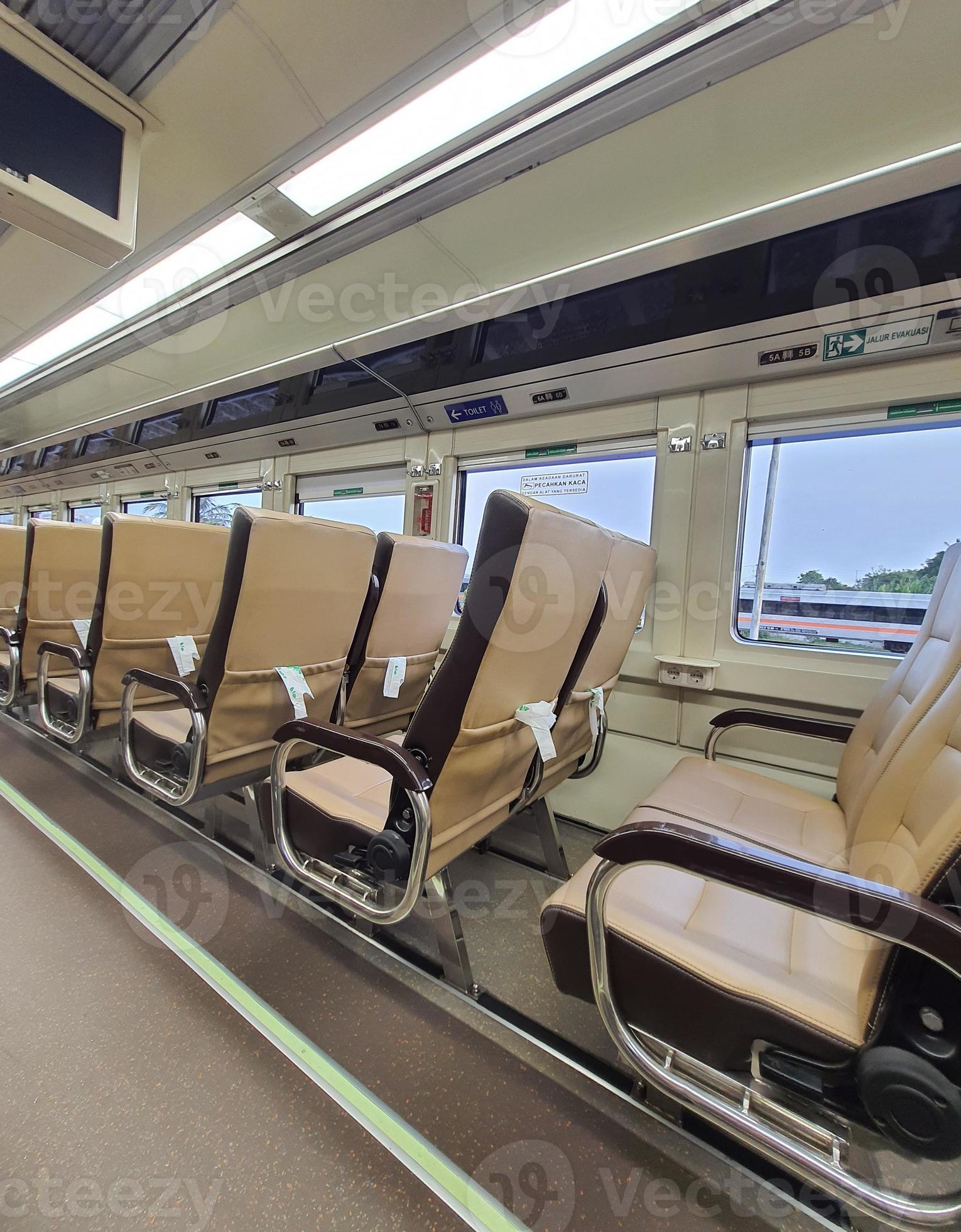 Premium economy train passenger seats in Indonesia. 11002993 Stock Photo at Vecteezy