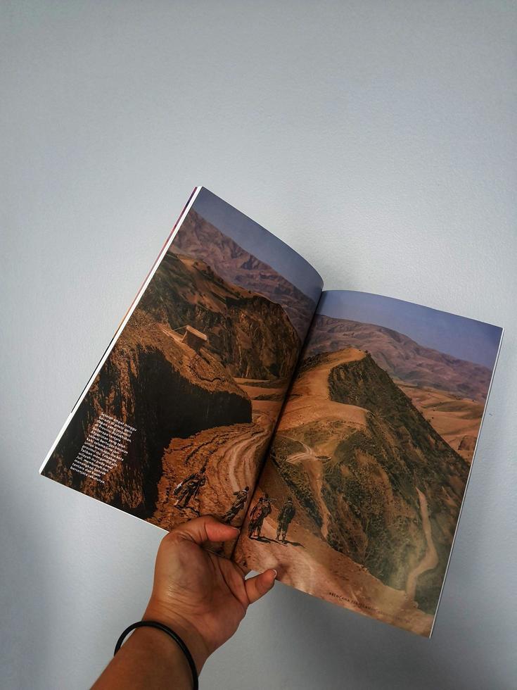 A hand holds the Indonesian version of the National Geographic magazine. The first version of National Geographic Indonesia was published in April 2005 until now. photo