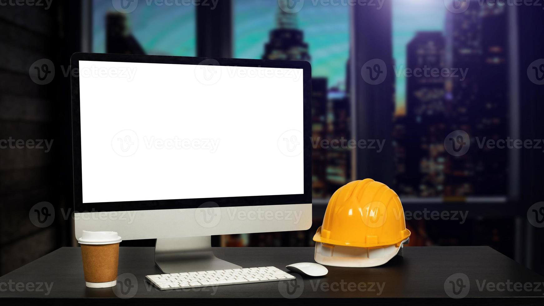 Workspace computer putting  and office construction on desk in office blurred background.Architect concept. photo