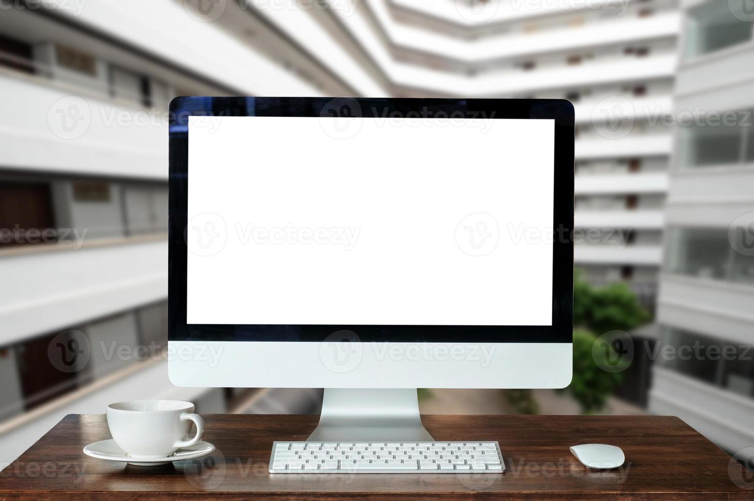 workspace with computer, laptop, office supplies, and coffee cup, smartphone, and tablet at office. desk work concept. photo