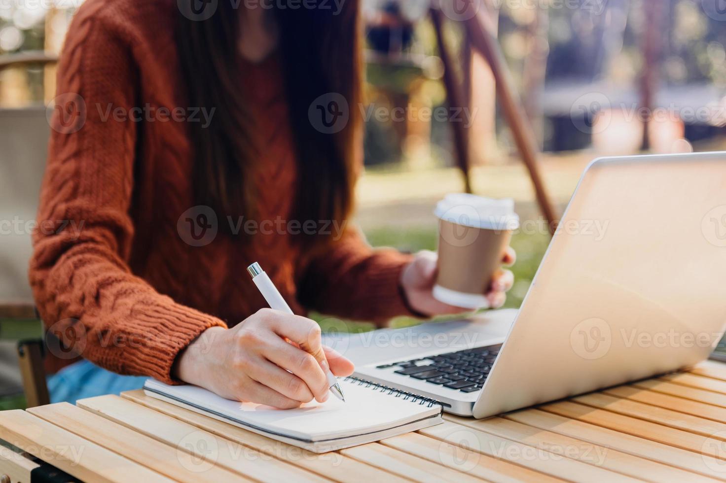 businessman hand working with new modern computer and writing on the notepad strategy diagram as concept photo