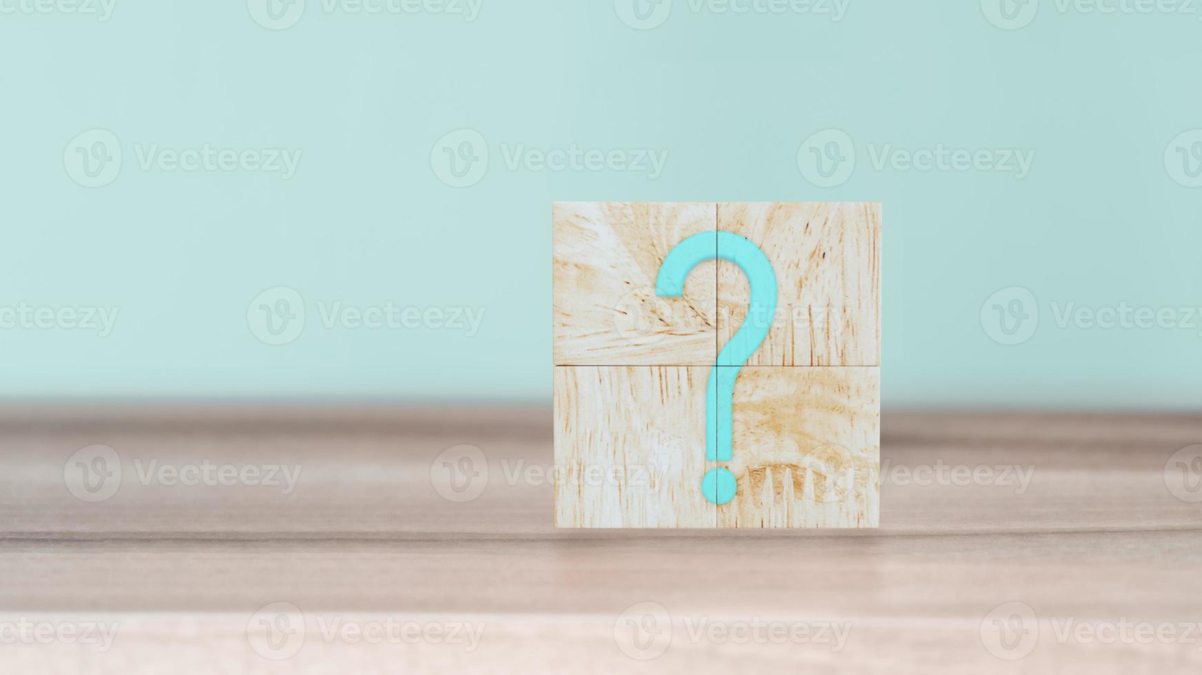 Question Mark word in wooden cube blocks on wood table with cyan wall background. photo