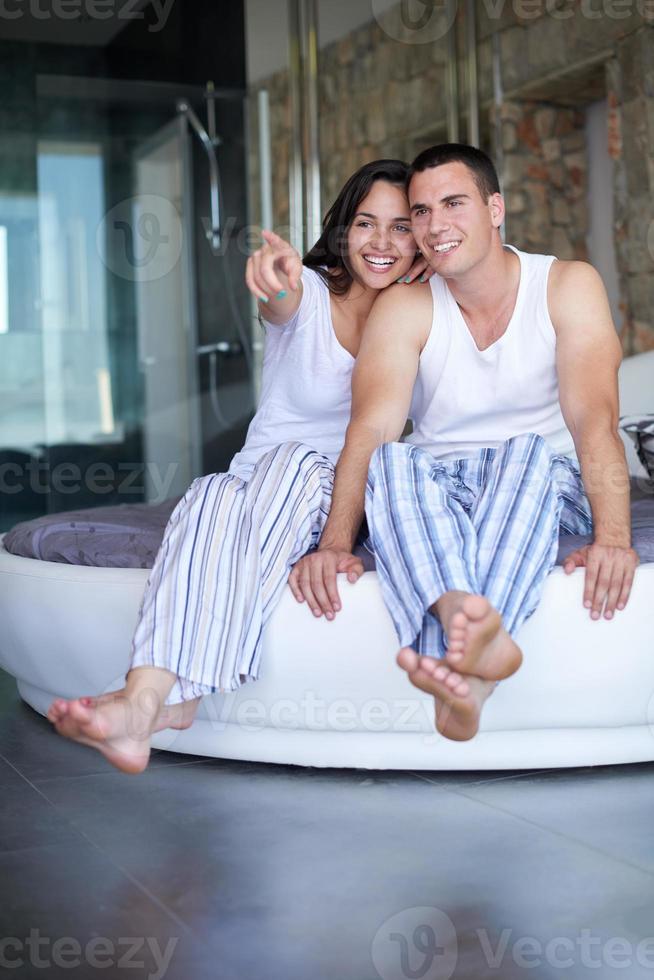 couple relax and have fun in bed photo