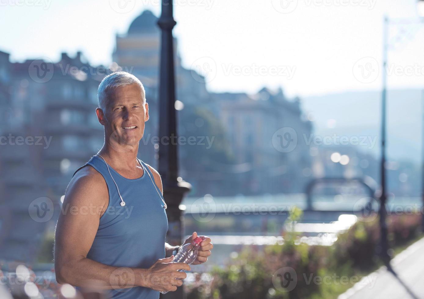 portrait of handsome senior jogging man photo
