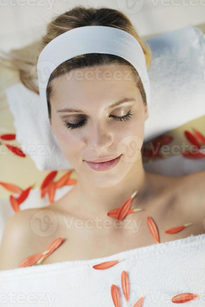 Beautiful young woman in spa photo