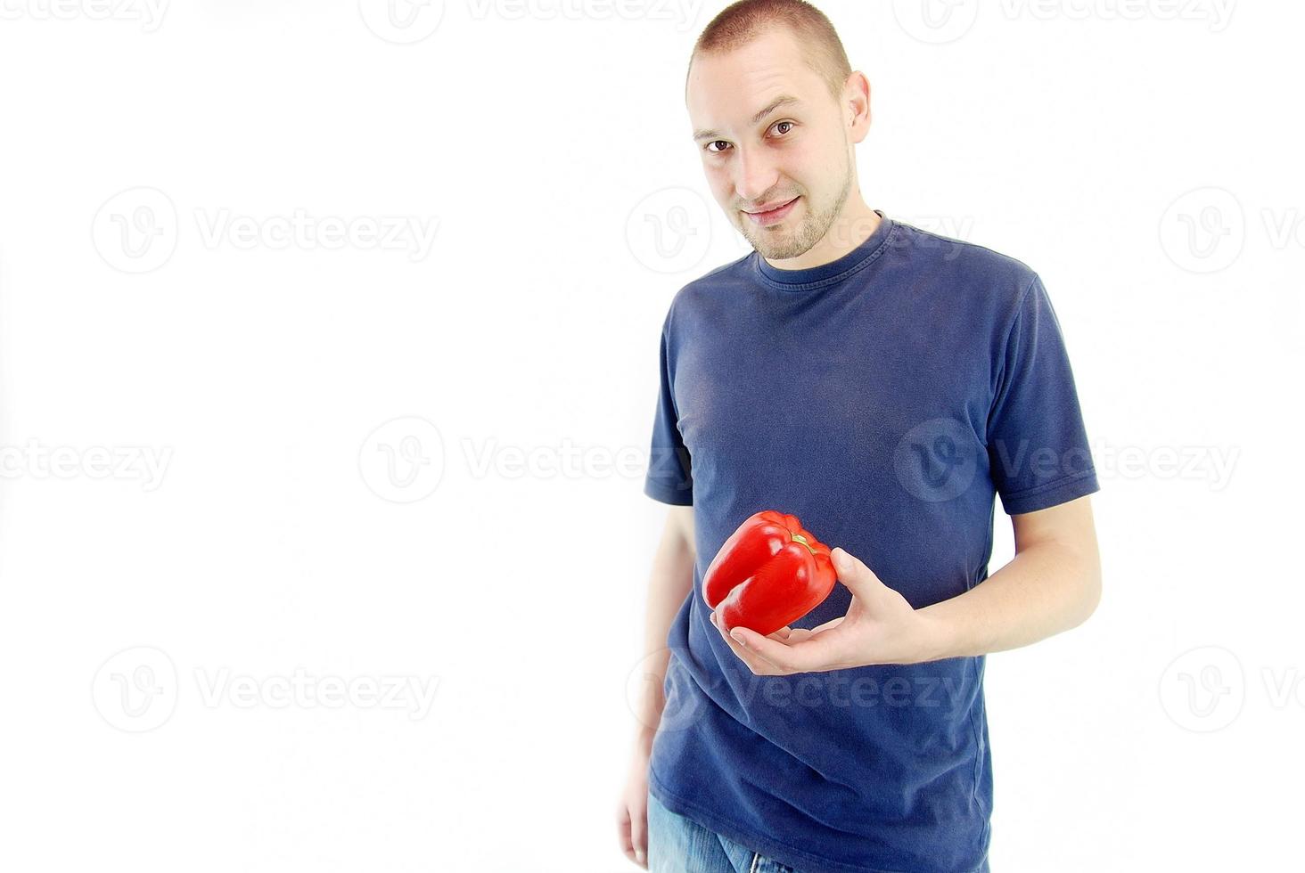 happy couple holding peppers with head photo