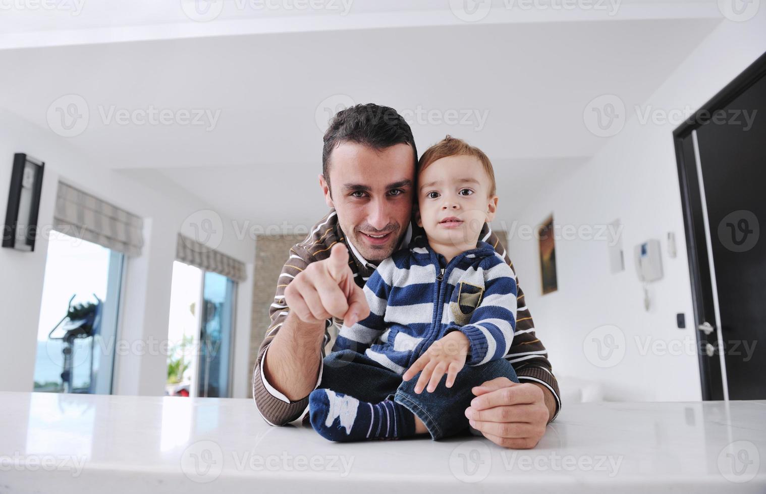 happy father and son together at home photo