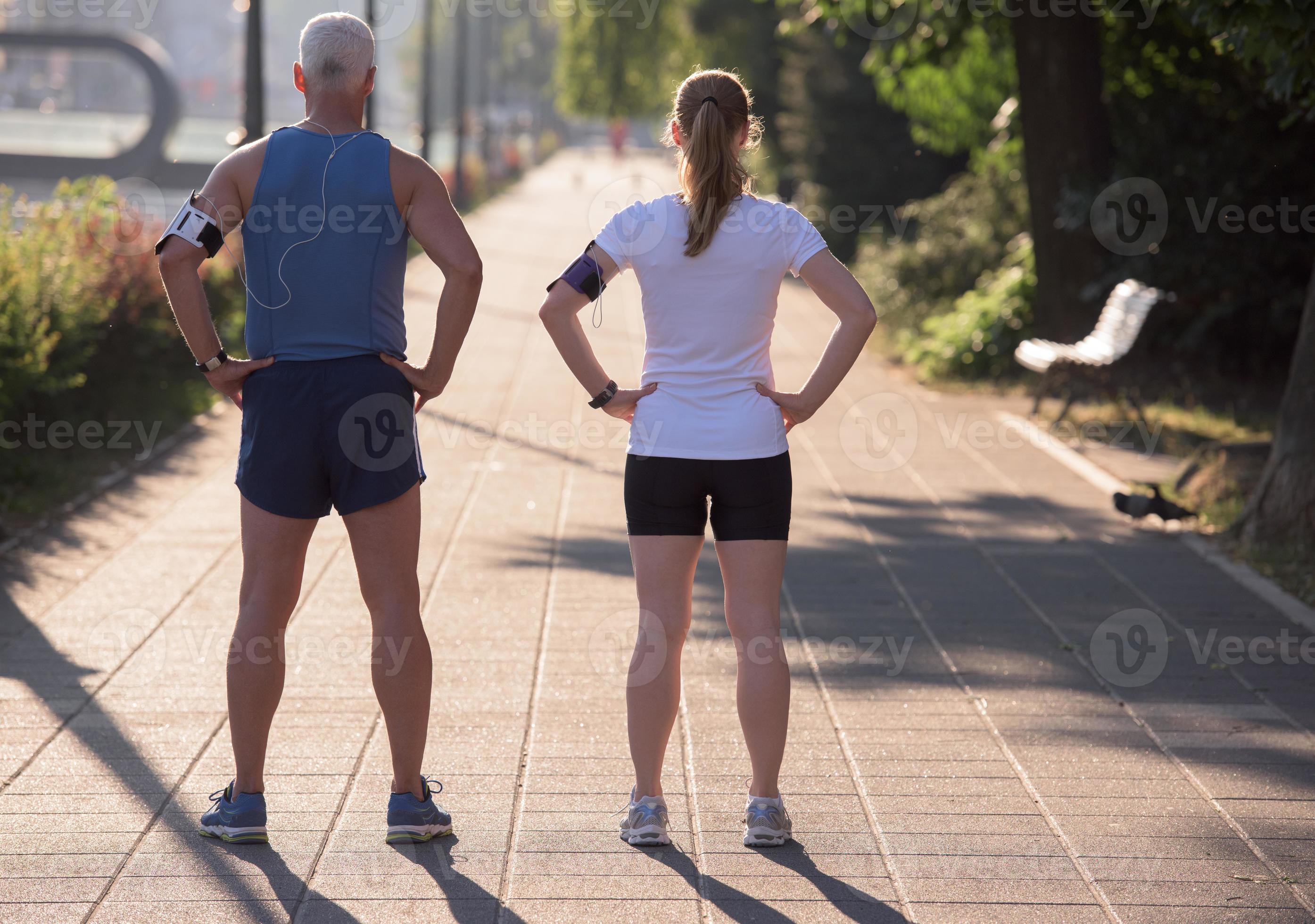 Jogging Couple Planning Running Route And Setting Music 11003970 Stock jogging-couple-planning-running-route-and-setting-music-11003970-stock