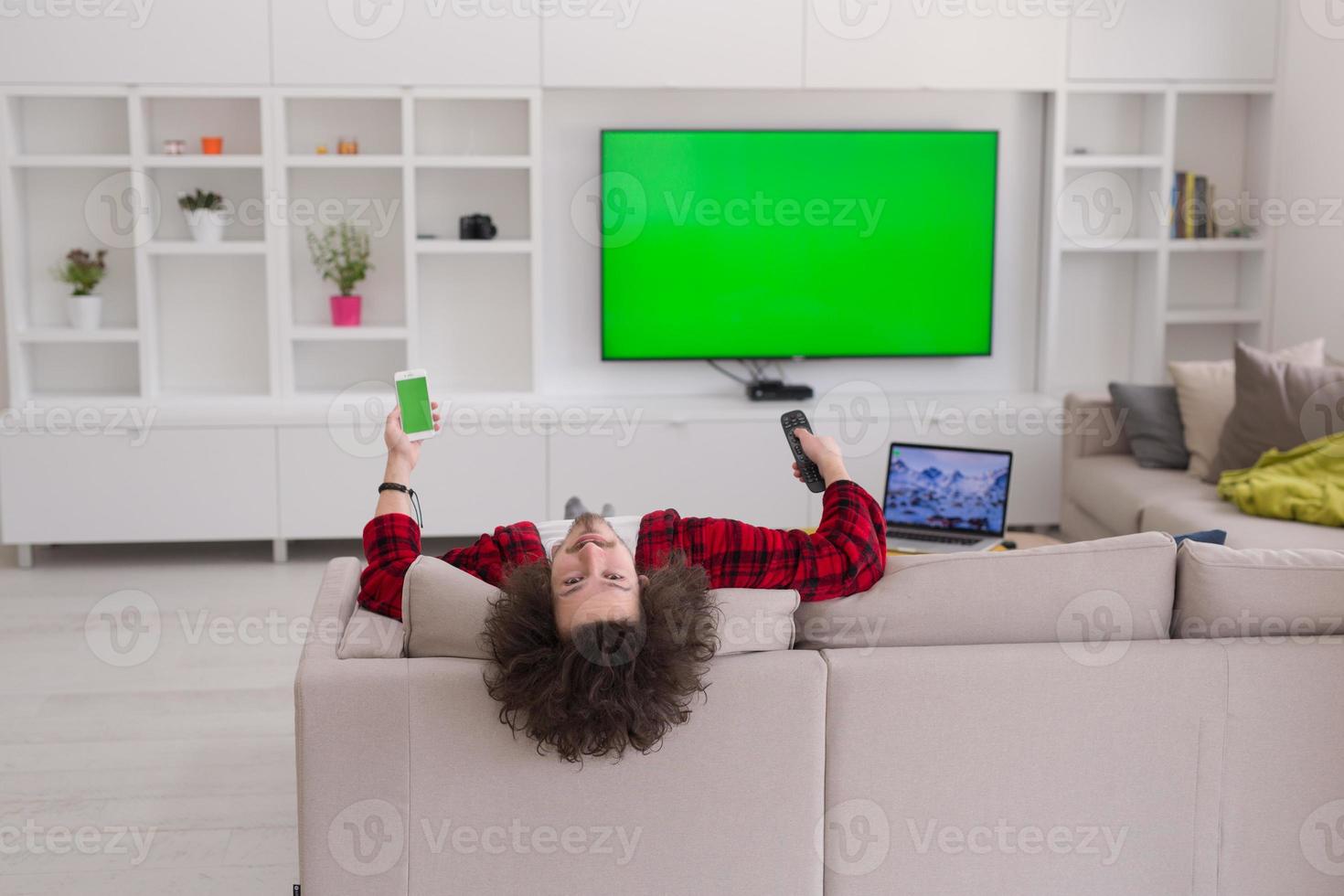 young man in bathrobe enjoying free time photo