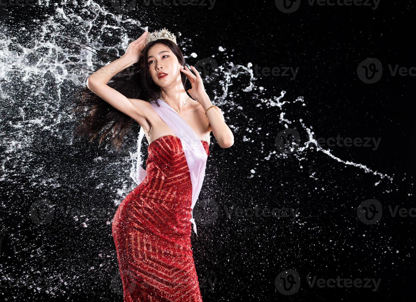 Water splash to back side of Miss Beauty Pageant Contest with diamond crown sash in droplet photo