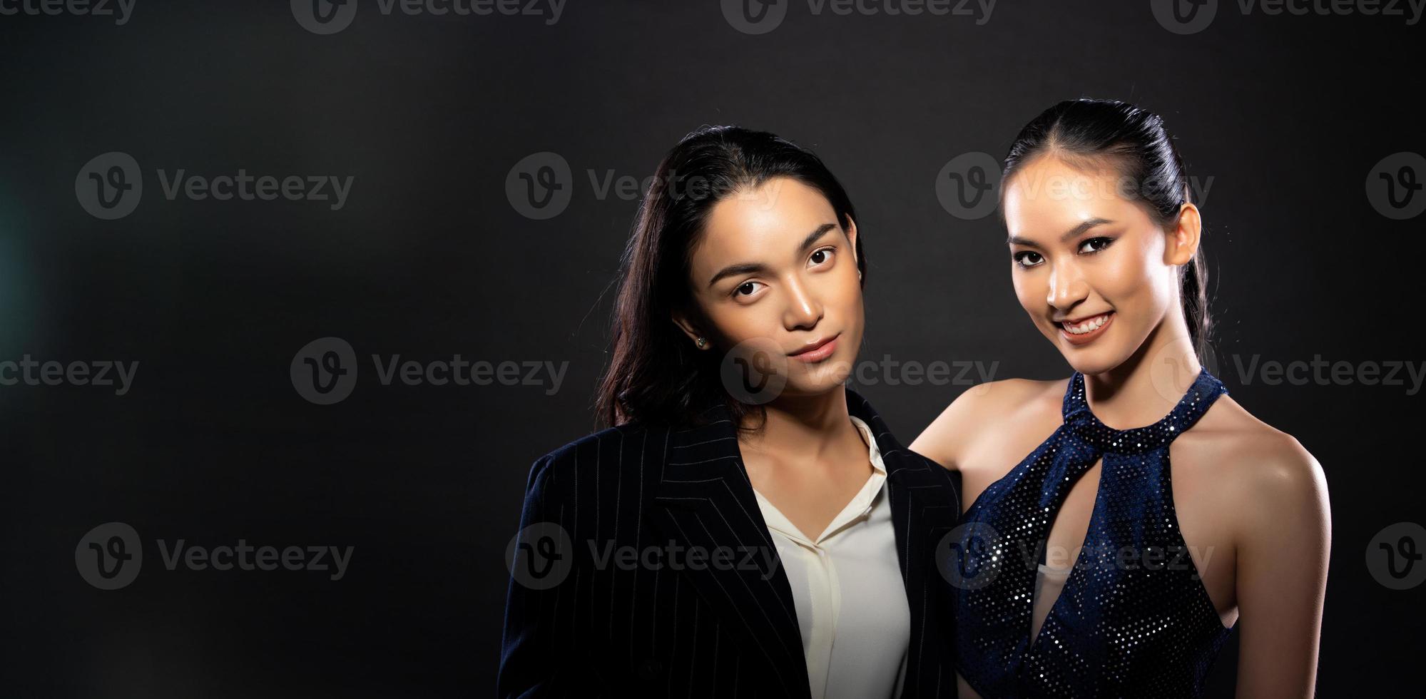 Asian beautiful woman and man wear formal blazer evening gown hold hug together and express smile photo
