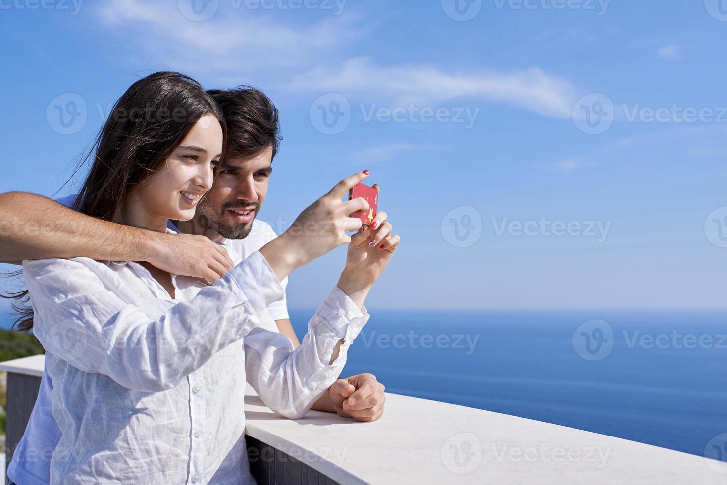young couple taking selfie with phone photo