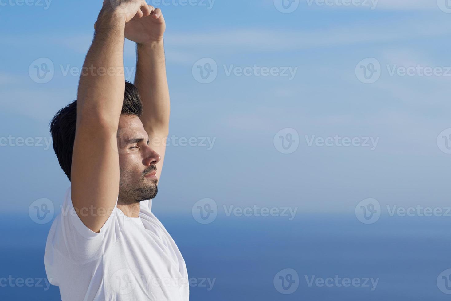 young man practicing yoga photo
