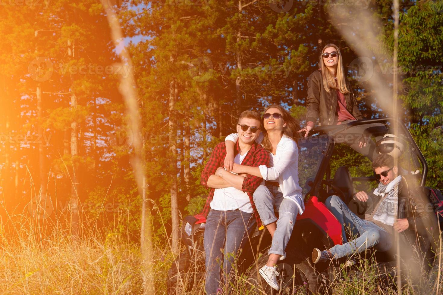 group of young people driving a off road buggy car photo
