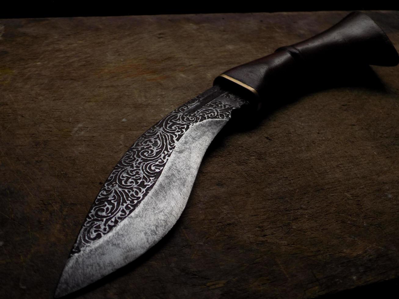 a knife with an iron engraving photo