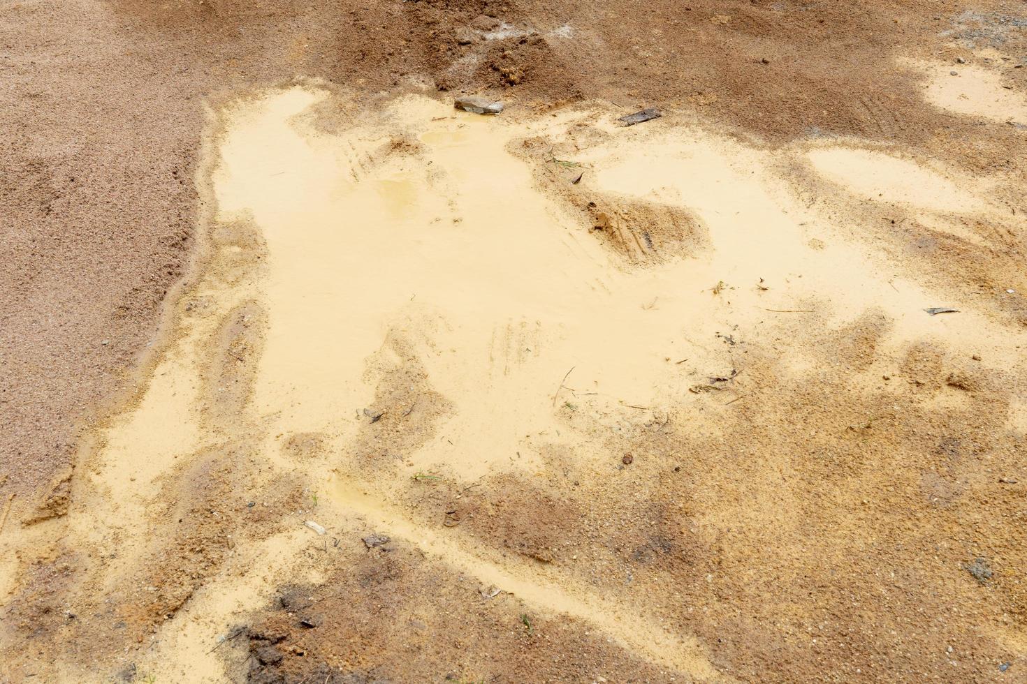 Flooding of the brown ground and the drifting of the wheels of a car. photo