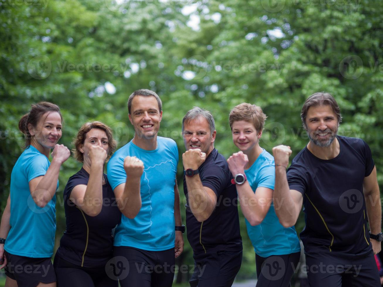 portrait of runners team on morning training photo