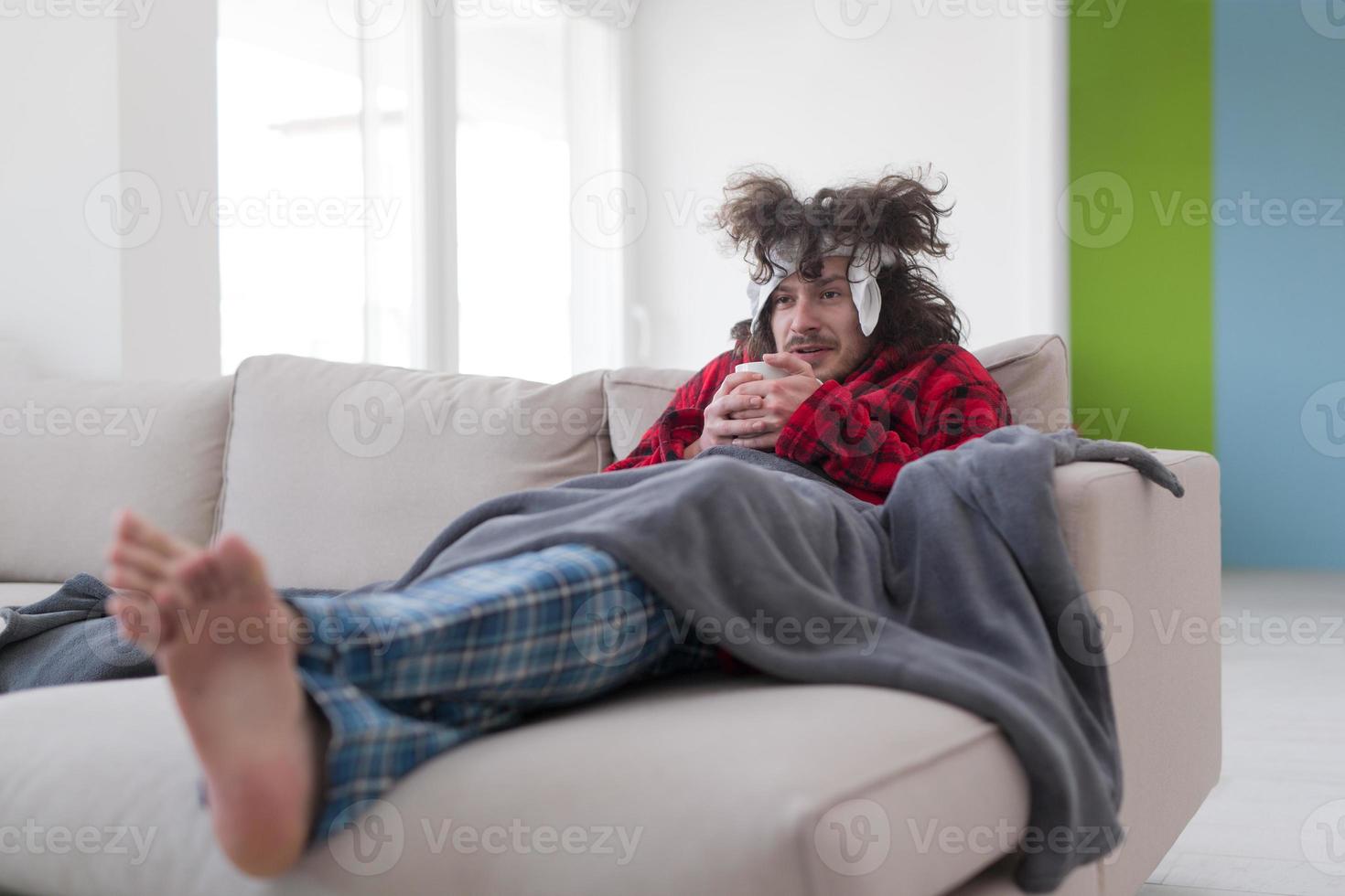 young Man with flu and fever photo