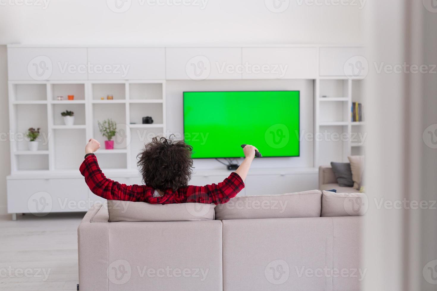 young man in bathrobe enjoying free time photo