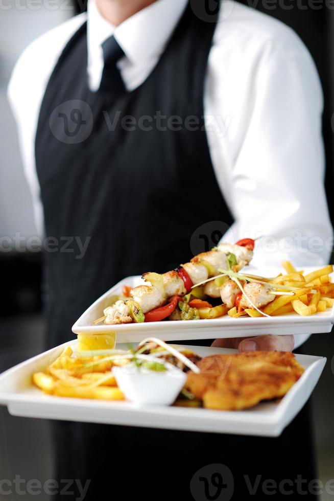 male chef presenting food photo