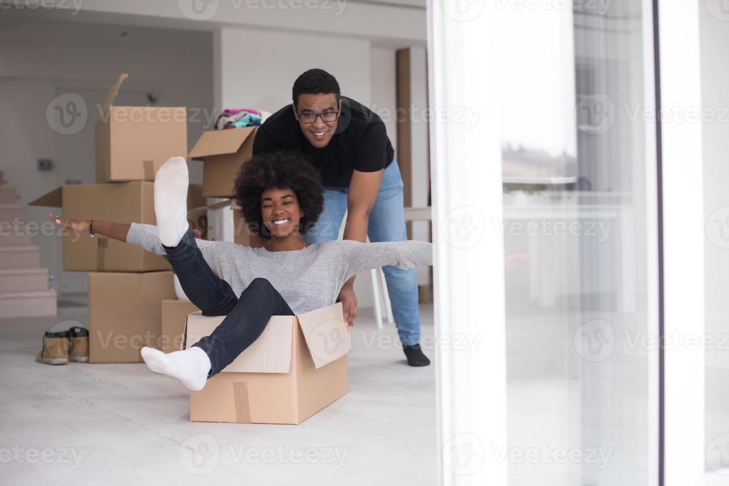 African American couple  playing with packing material photo