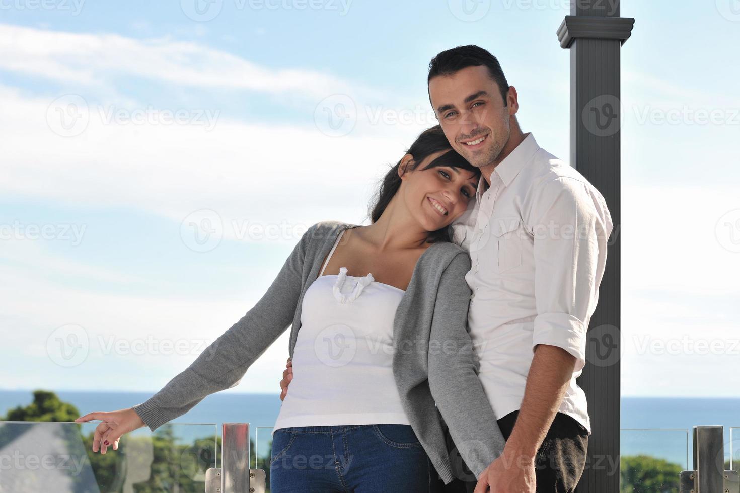 couple relaxing on balcony photo