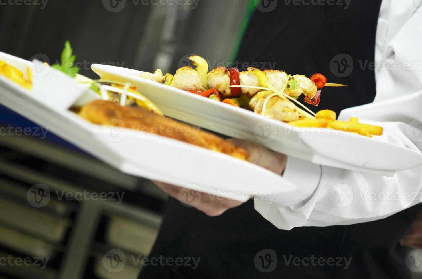 male chef presenting food photo