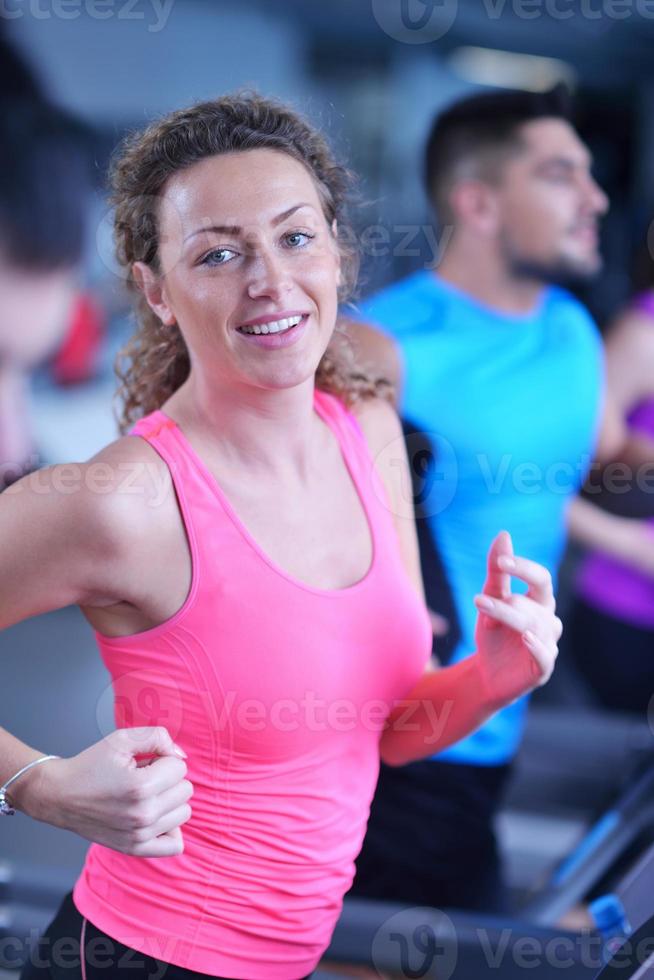 woman exercising on treadmill in gym photo