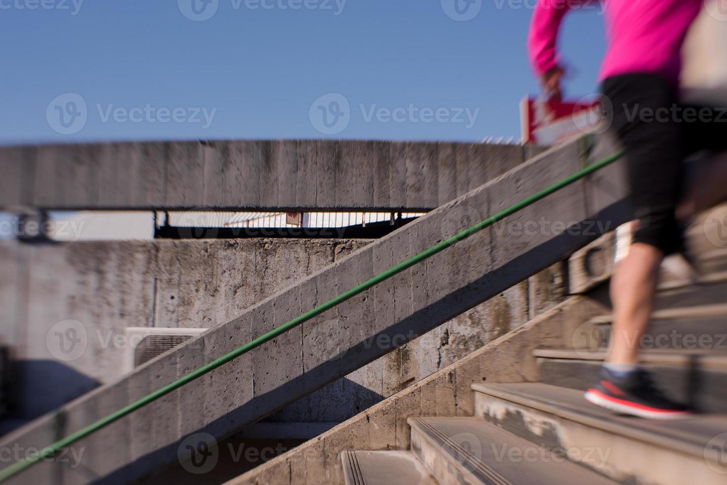 woman jogging on  steps photo