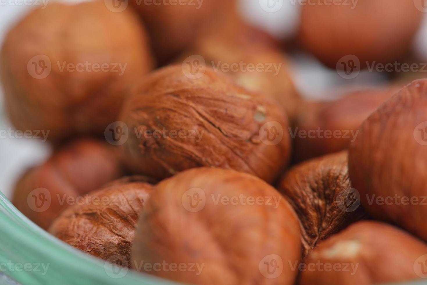 hazelnut on white surface photo