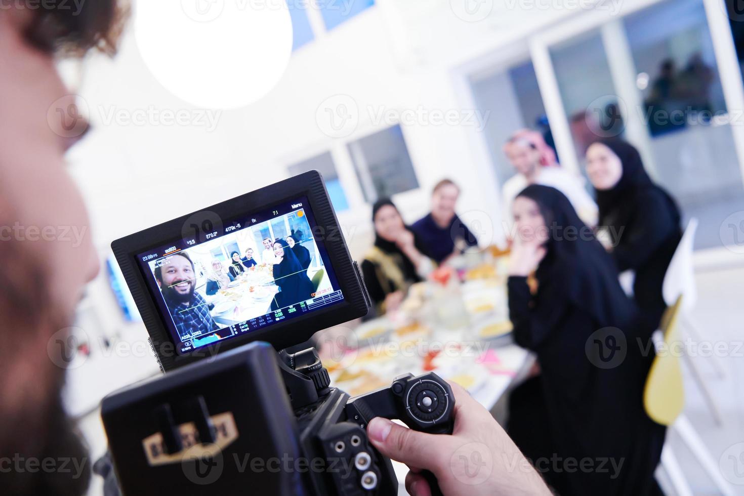 professional videographer recording Ramadan feast photo