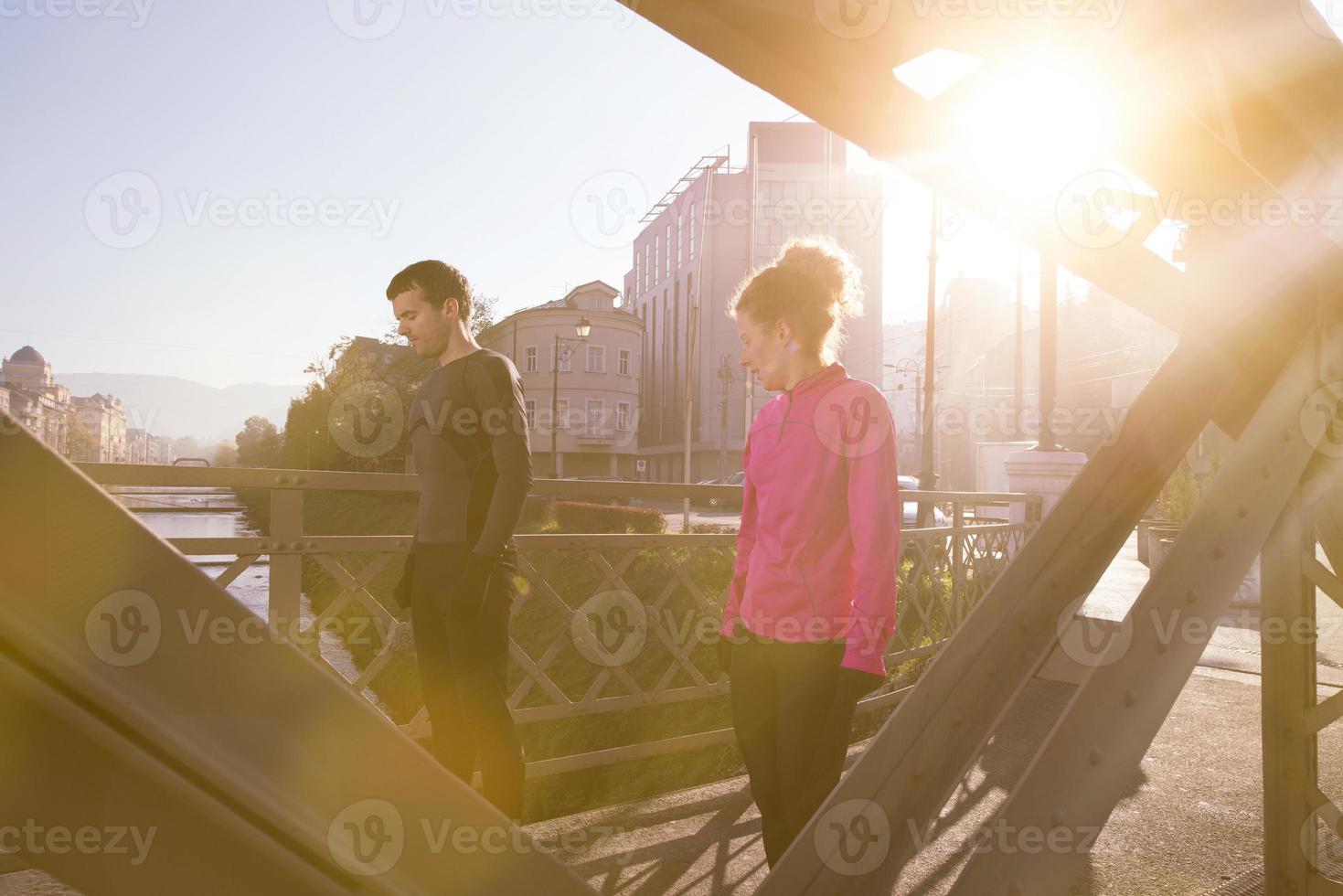 healthy young couple jogging in the city photo