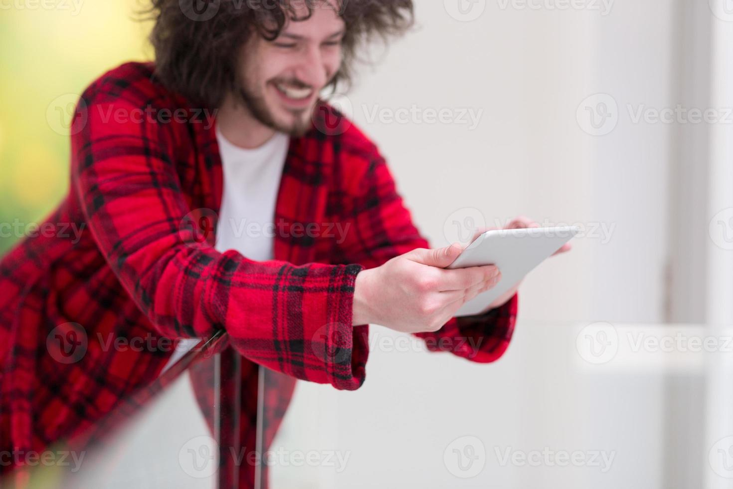 young freelancer using tablet computer photo