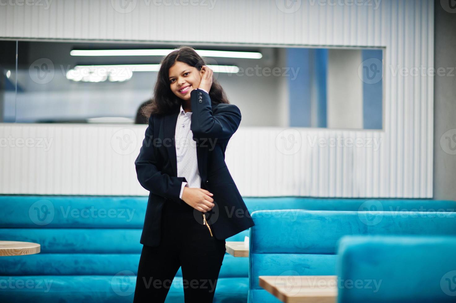 Gorgeous indian woman wear formal posing at cafe. photo