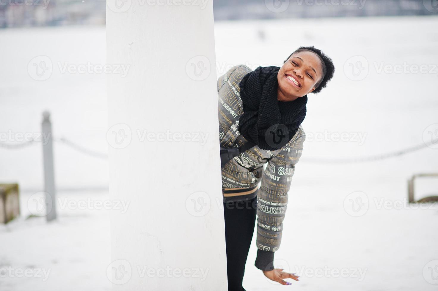 African woman wear in black scarf pose in winter day at Europe. photo