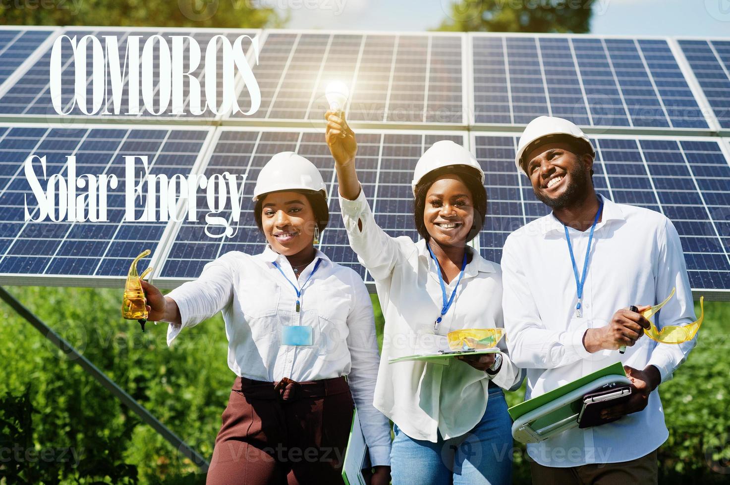 Comoros solar energy. African engineers at panels station. photo