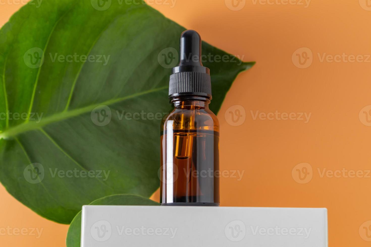 Dropper glass Bottle Mock-Up. Body treatment and spa. Natural beauty products. serum, skin care blank bottle. Anti-cellulite massage oil. Oily cosmetic pipette photo