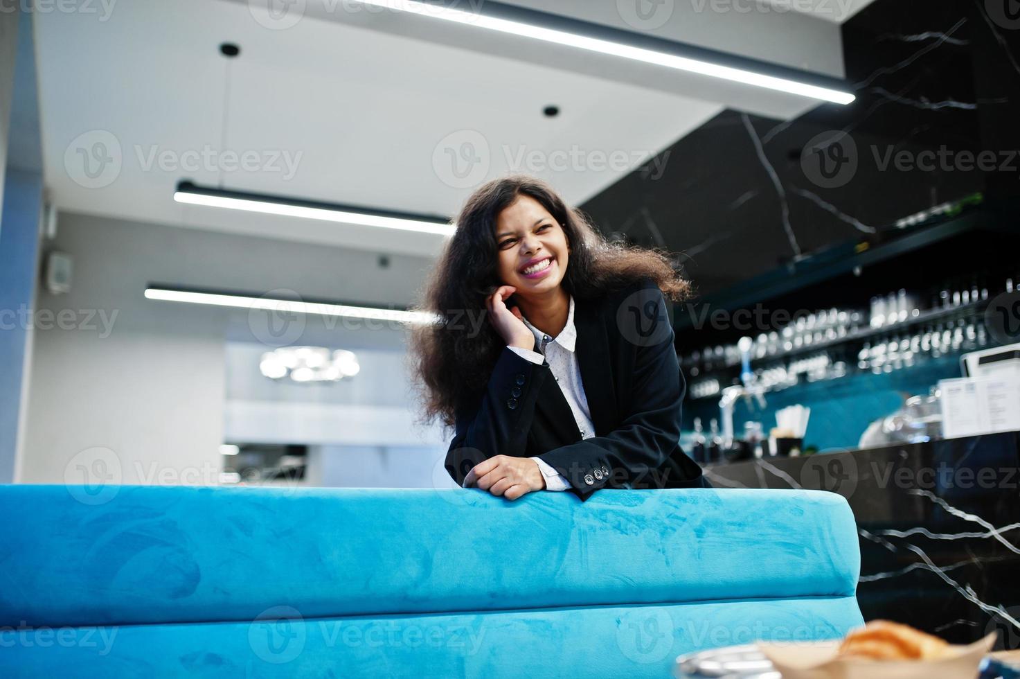 Gorgeous indian woman wear formal posing at cafe. photo