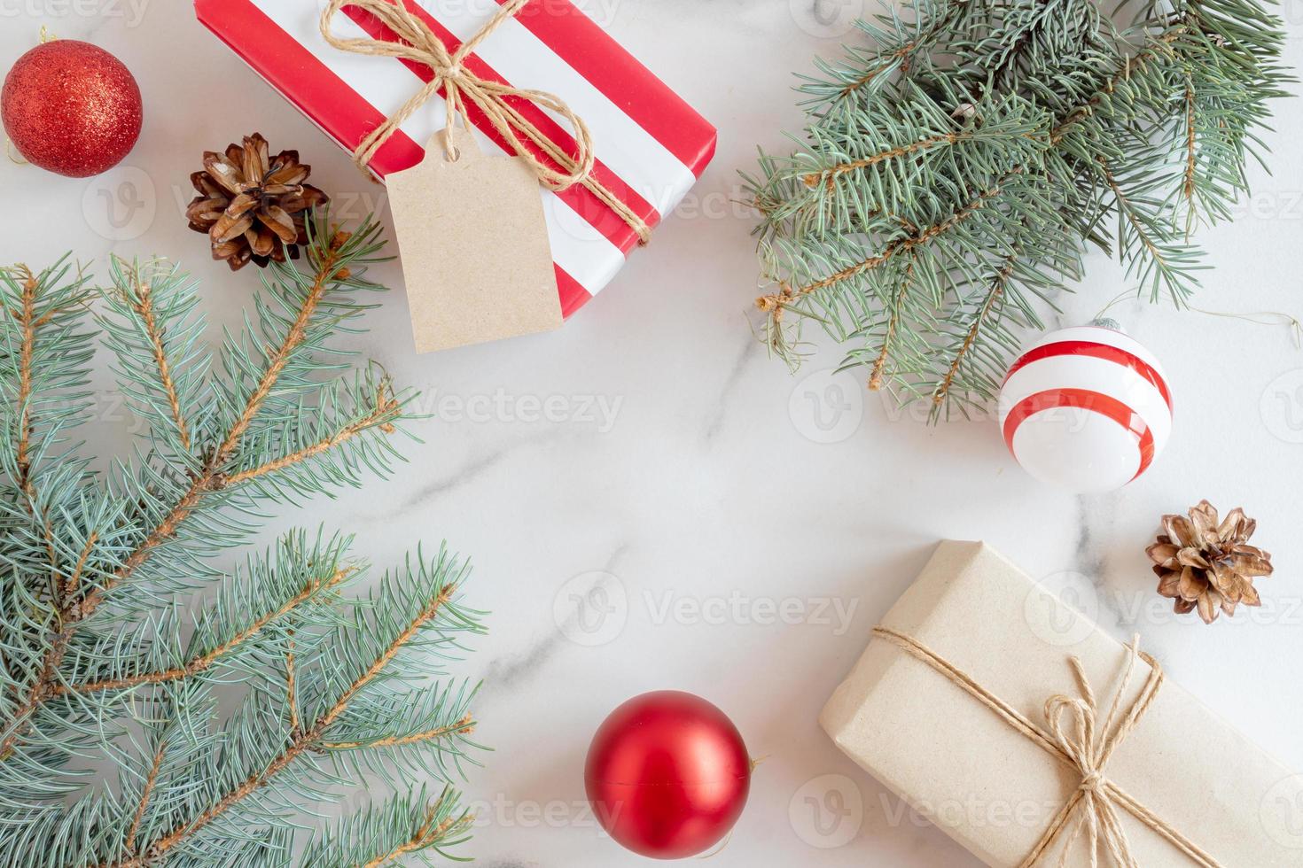 Gift boxes and Christmas decorations on marble background, flat lay. Space for text photo