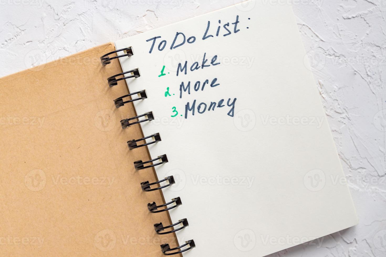 To do list - make more monTo do list - make more money written text on note pad. Close upe written text on note pad. photo