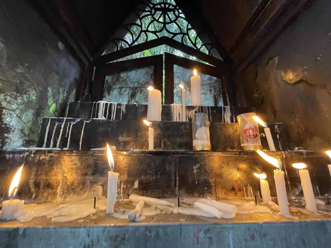 Klaten, Central Java, Indonesia, 2022, Bunch of prayers candle flames