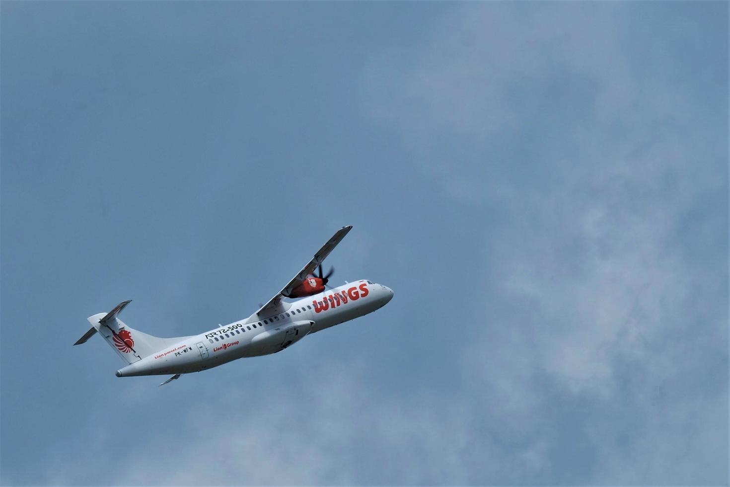 Makassar, Indonesia, August 2, 2022 - One of the commercial aircraft is taking off at Makassar's Hasanuddin airport. photo