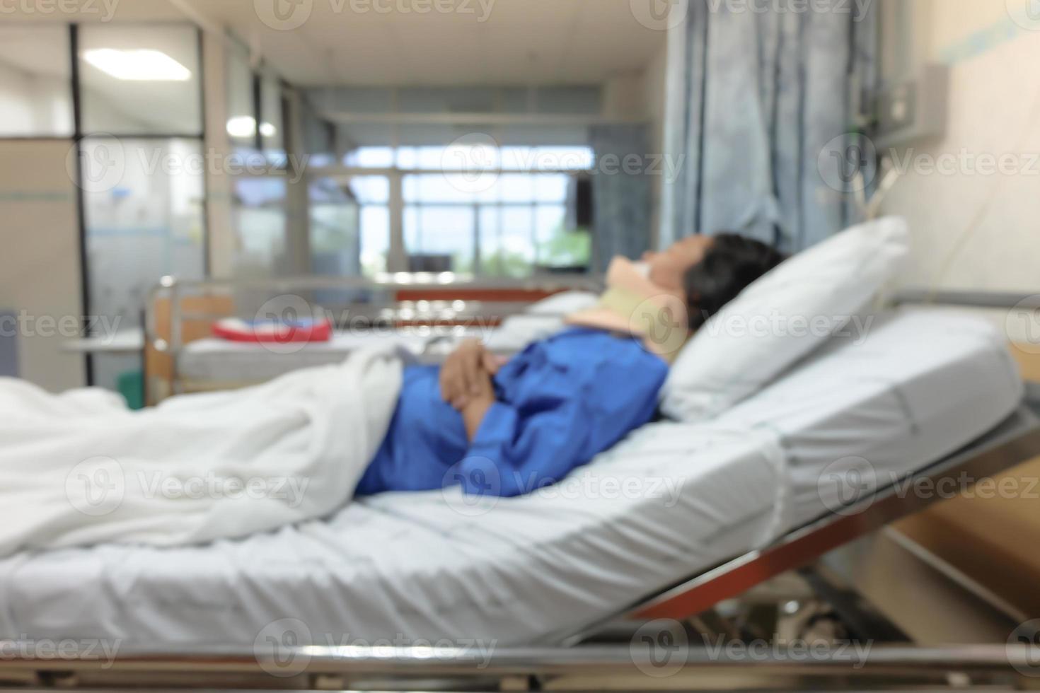 Blurred ,Woman after surgery patient sleeps on a bed in hospital. photo