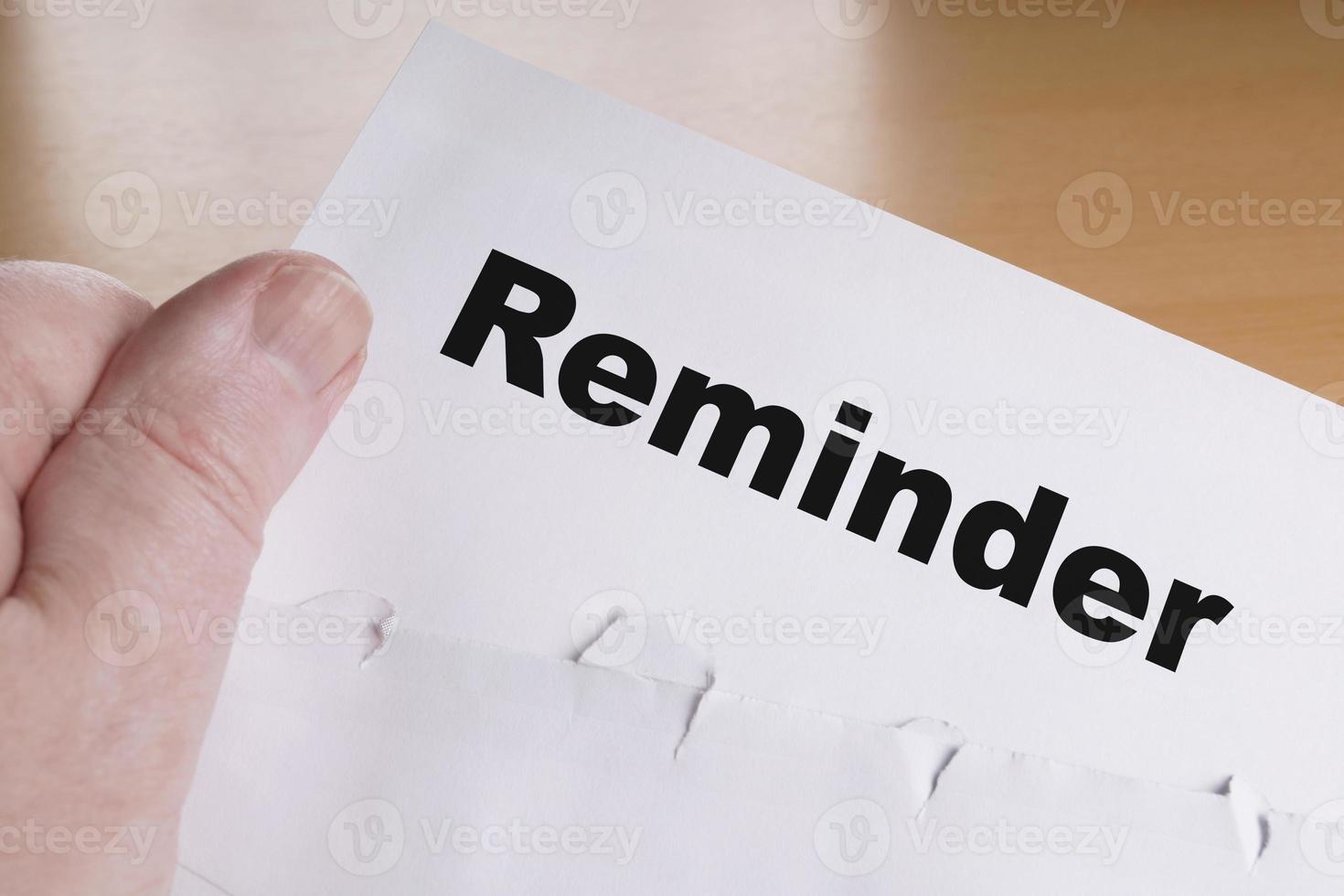 hand holding reminder letter photo