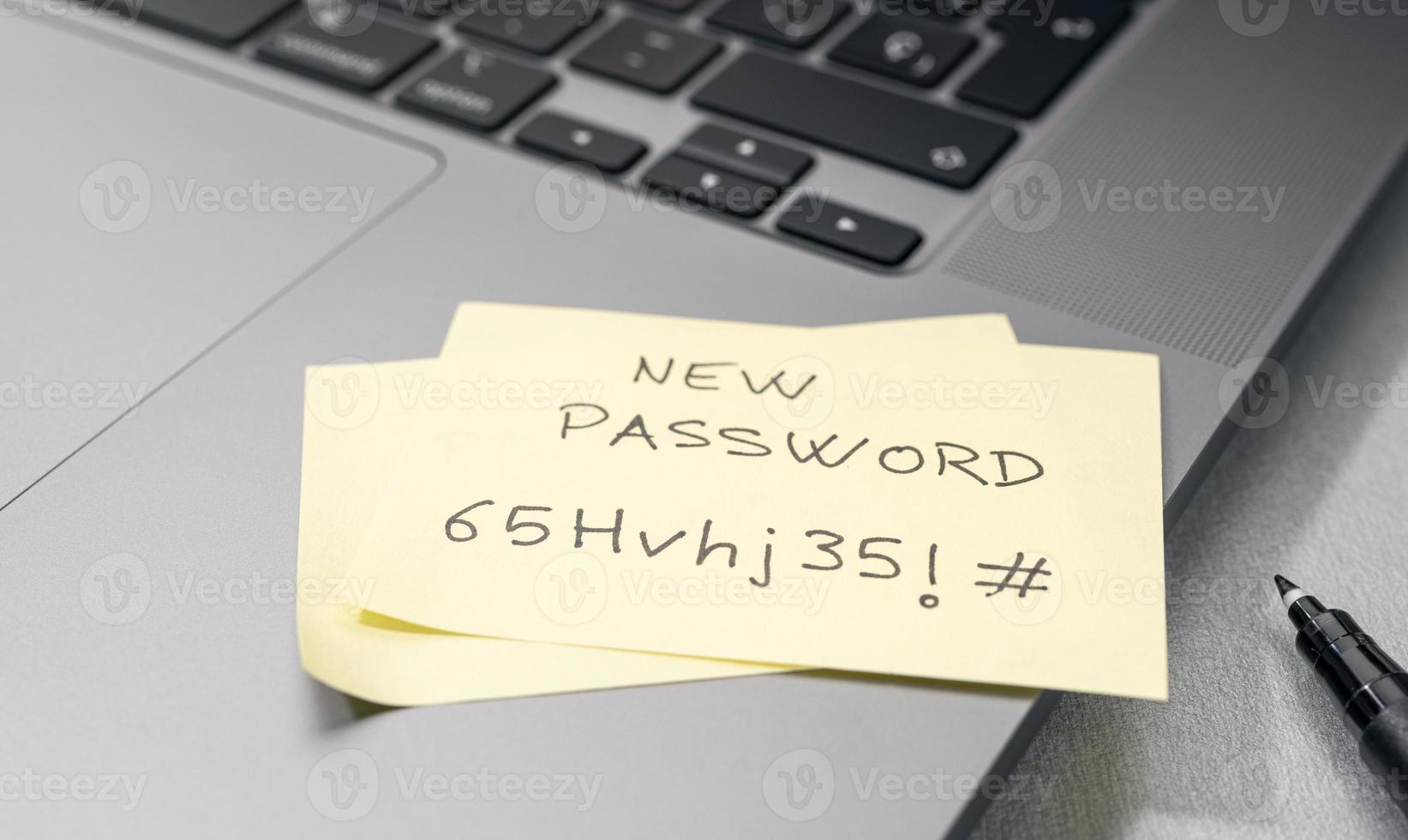 Change of password to a stronger one- Message on sticky note on laptop. Computer security management concept photo