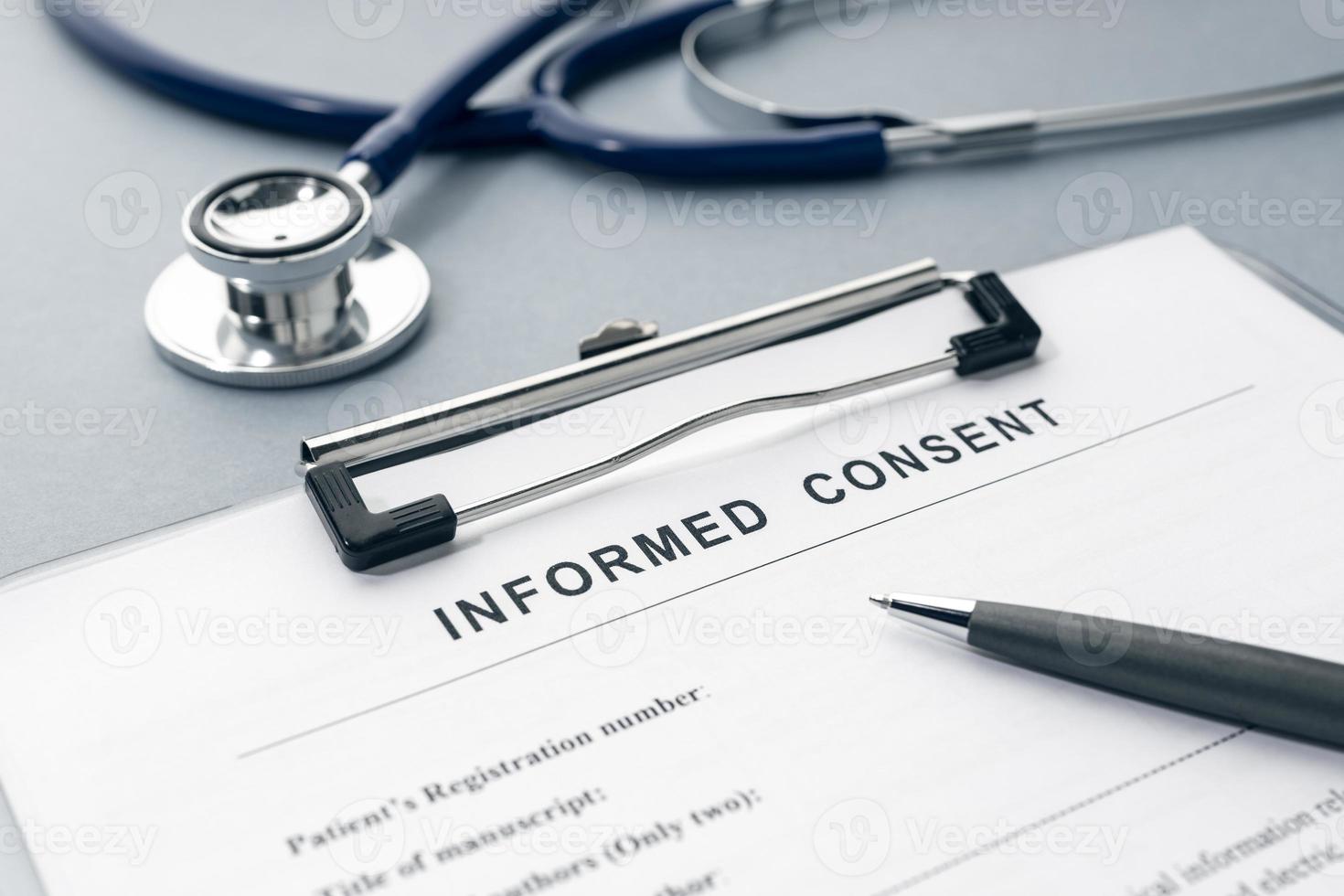 Informed Consent form and stethoscope on desk photo