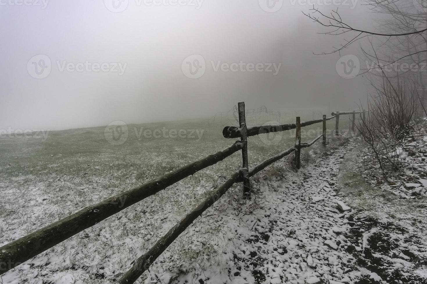 Winter footpath around wooden corral photo
