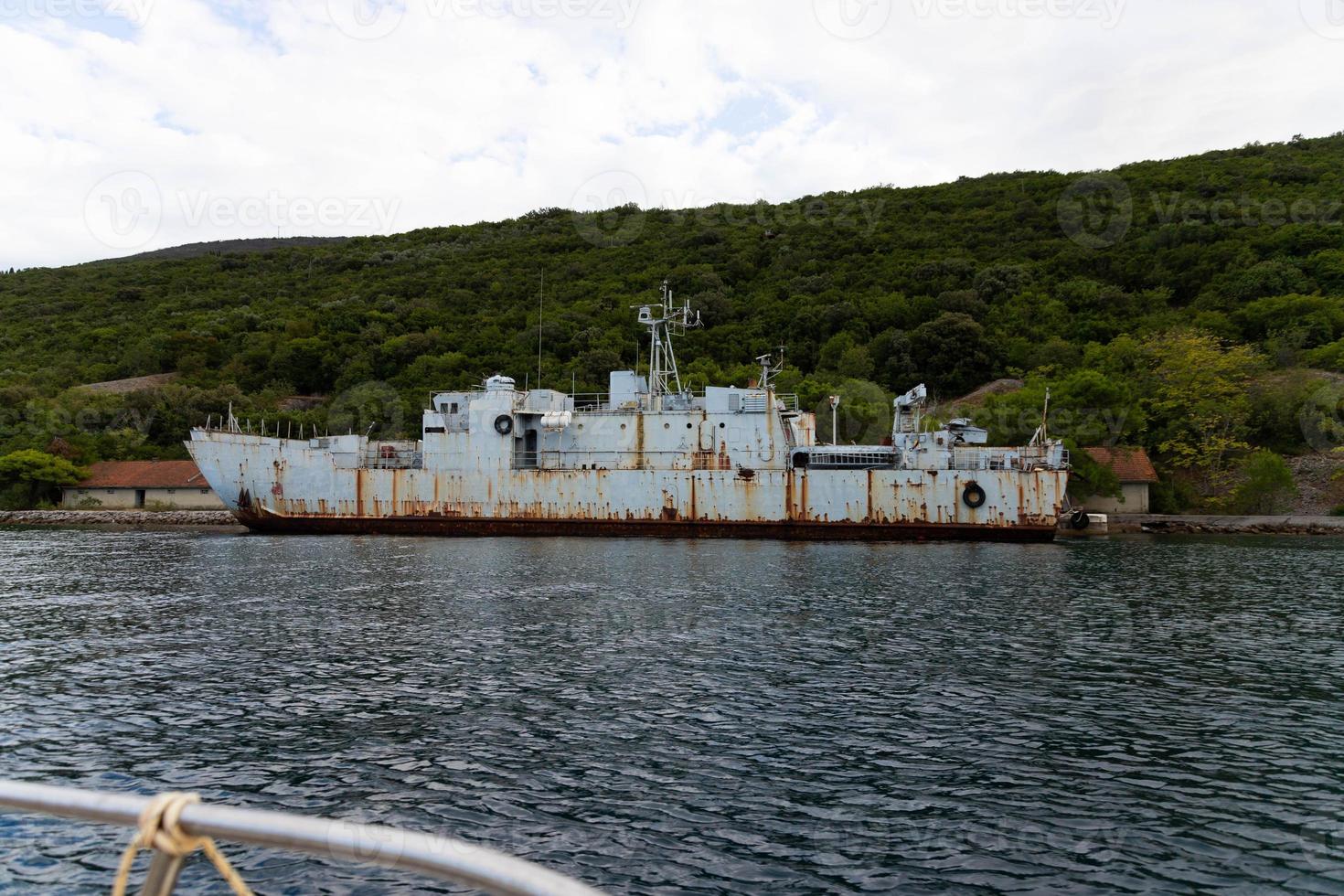 Old, rusty, decommissioned warships off the coast of the adriatic sea photo