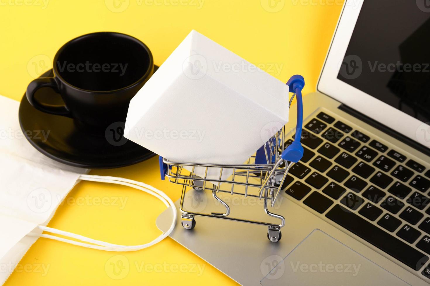 Empty mini shopping trolley, Shopping cart, on a yellow background. RFI Request for information. copy space photo