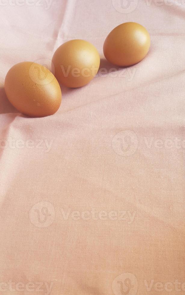 Eggs on a pink cloth. photo